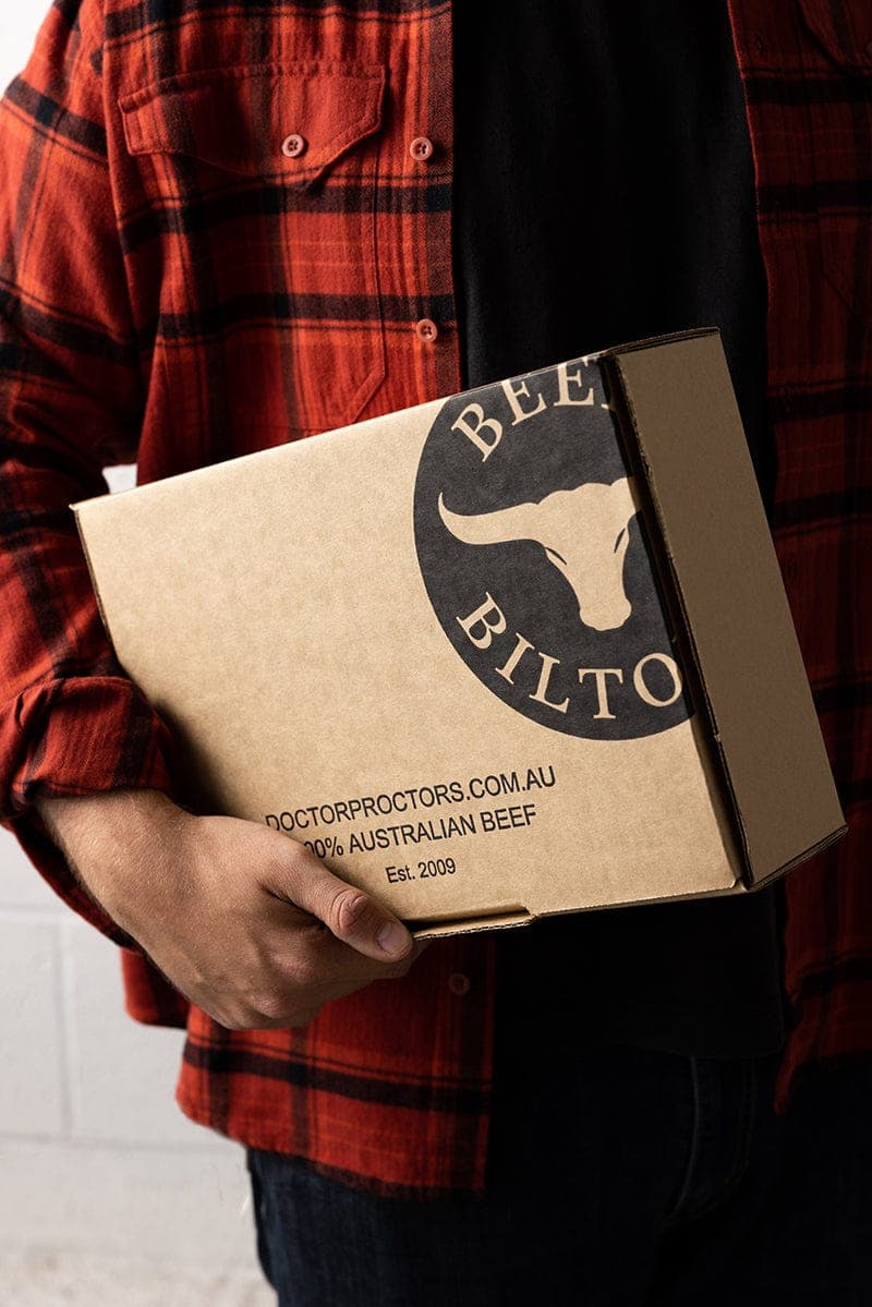 Man holding box of biltong