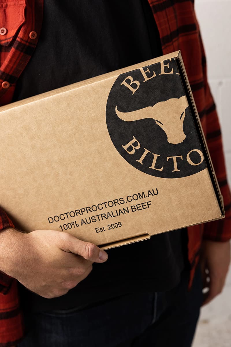 Man holding box of beef jerky