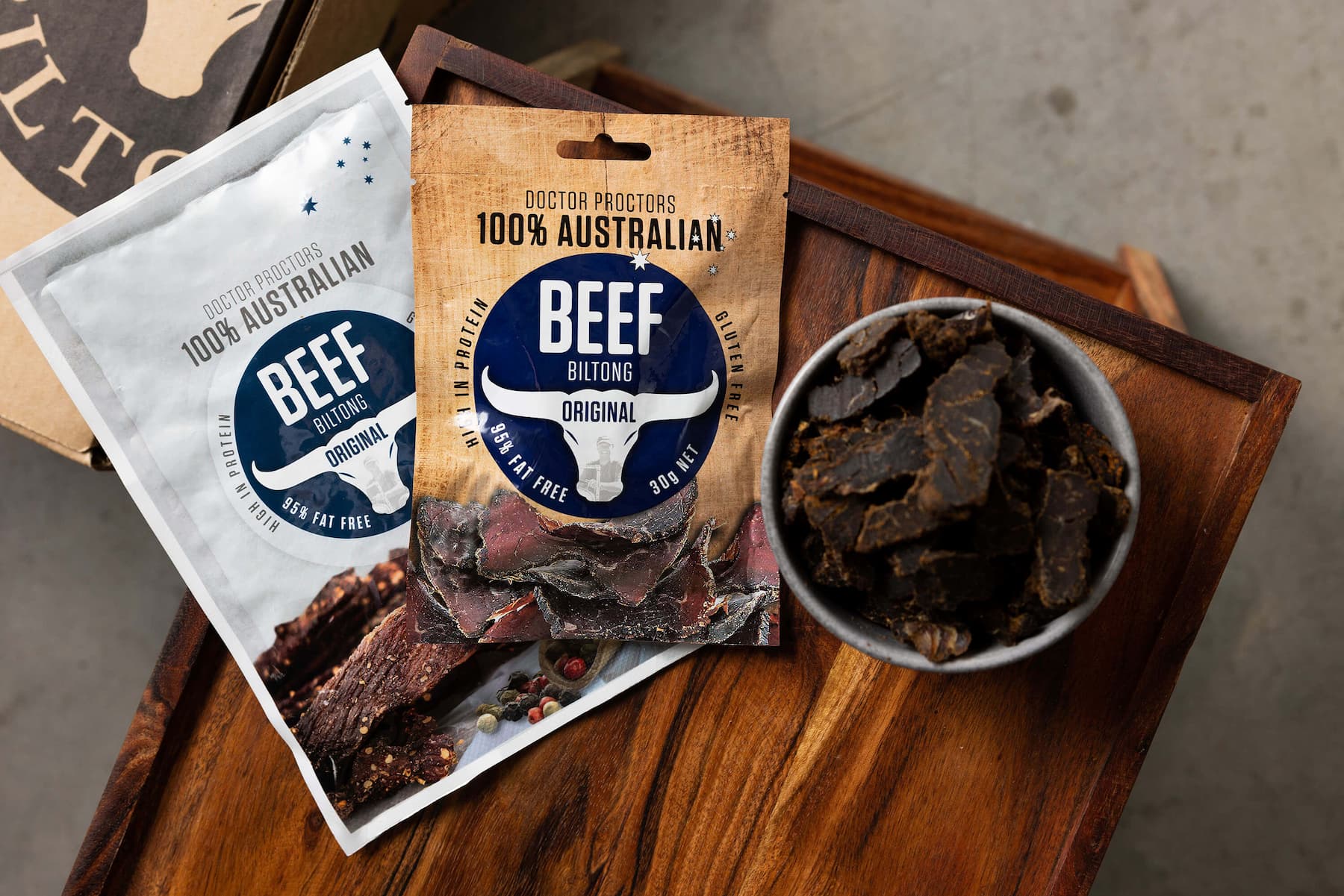 Original beef biltong on table next to bowl of biltong