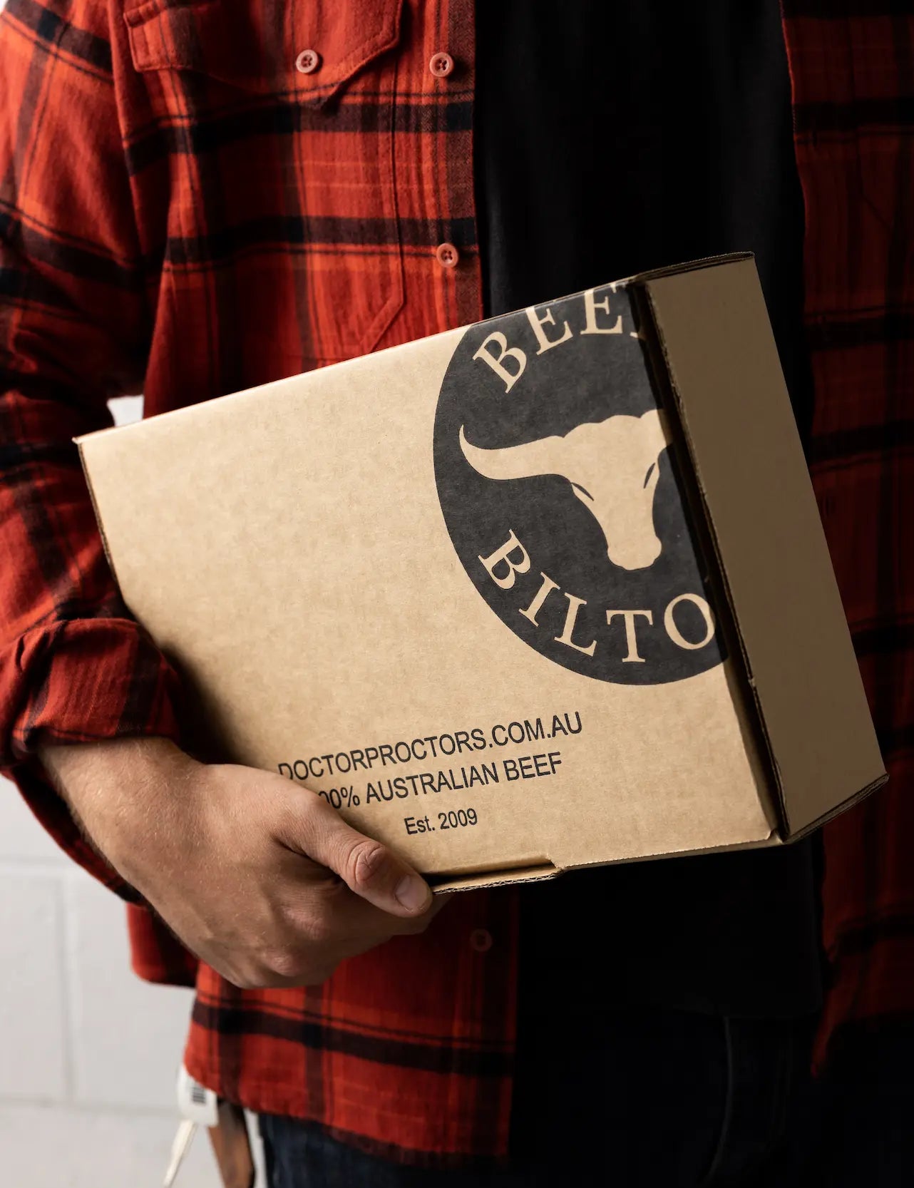 Man holding box of beef jerky